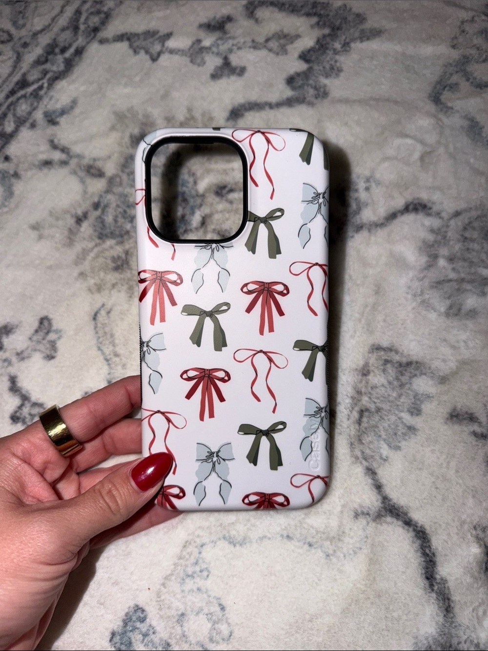 Stylish White Bow Pattern Phone Case - Red & Olive Accents iPhone 15 Pro Max